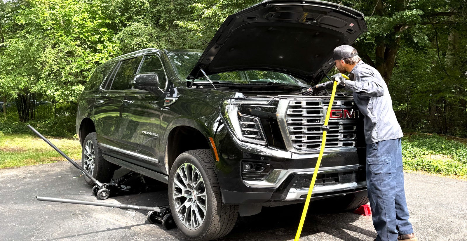 Certified Matick Technician performing mobile service in a customer's driveway